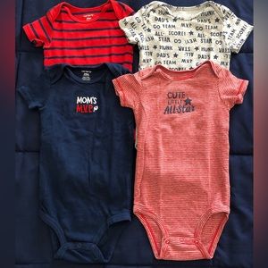 Carter’s Bundle of Four Sport Onesies in size 24 months